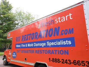 911-Restoration Water-Damage-Restoration-Truck-Parked-At-Residential-Job-Site New Orleans