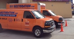 911-Restoration Water-Damage-Restoration-Vans-At-Commerical-Job-Location New Orleans